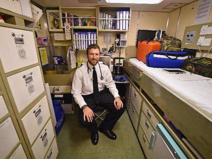 A surgeon in the sick bay of the submarine.