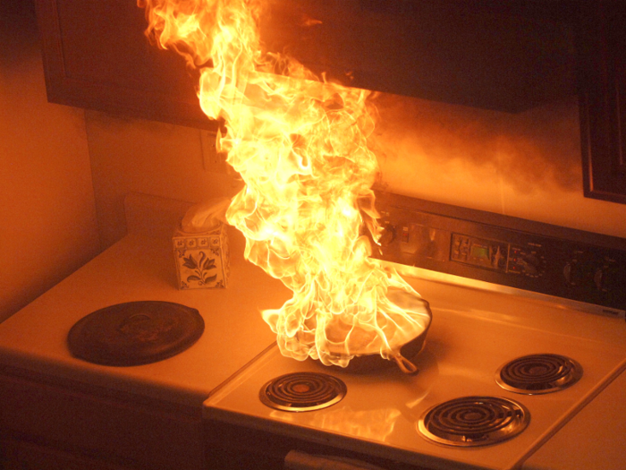 If cooking oil catches fire, turn off the burner and cover the pot.