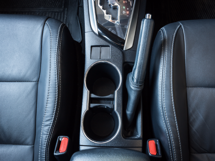 Car cup holders are almost never on the left. Would you want to drink piping hot coffee with your non-dominant hand?