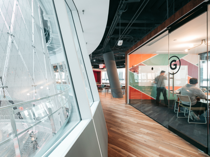 The windows on one side of the office overlook the atrium of Fulton Center.