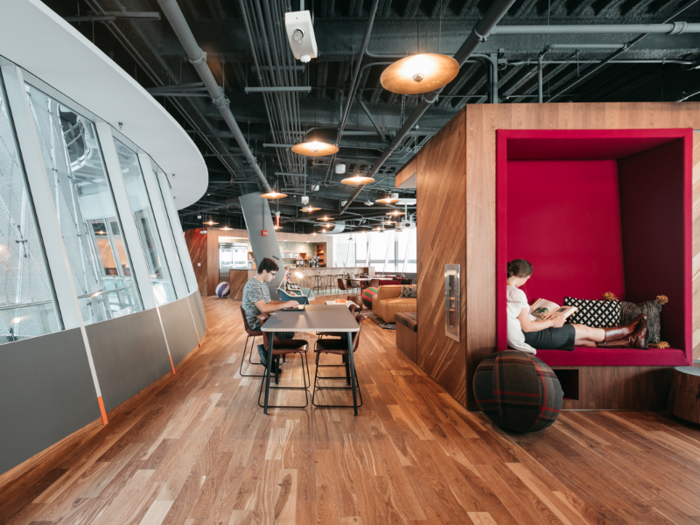 WeWork offers its plenty of places to sit and work, like overstuffed couches, a reading nook, and more traditional tables and desks.