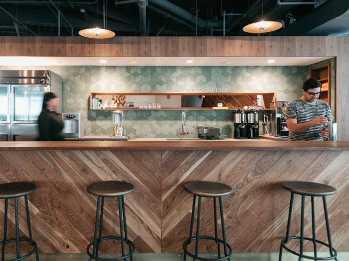 Each WeWork has millennial-friendly amenities like beer on tap and La Colombe coffee.