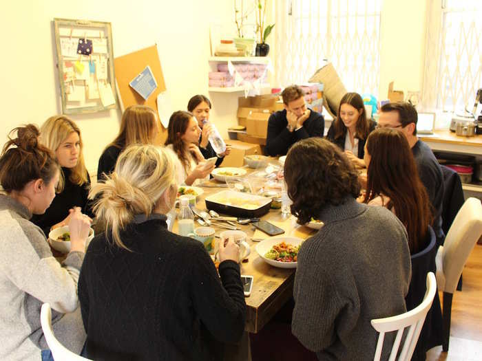 They then sit down for a team meeting — an impressive spread of food included.