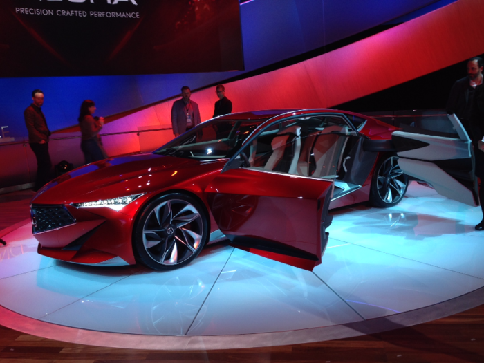 The car also features suicide doors and comes with a massive, curved display on the inside.