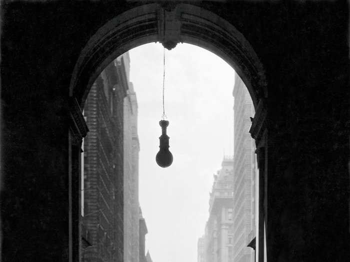 Pennsylvania, 1932: Narrow vista on Broad Street. Philadelphians come and go through an archway at City Hall.