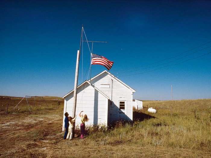 Nebraska, 1978: In Cherry County, Nebraska, the day begins at School 100 with the raising of the flag by the school