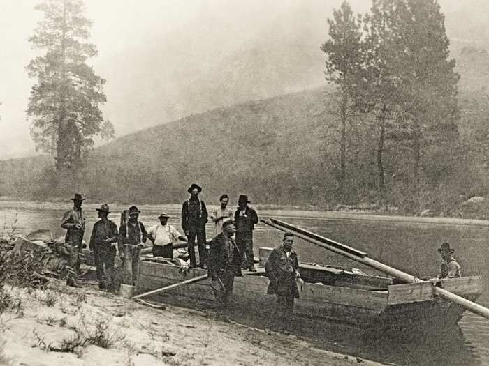 Idaho, 1900: Boatmen on an Idaho river. The long rudder oar was used to help guide the boat through rapids on rivers like the Snake or the Salmon.