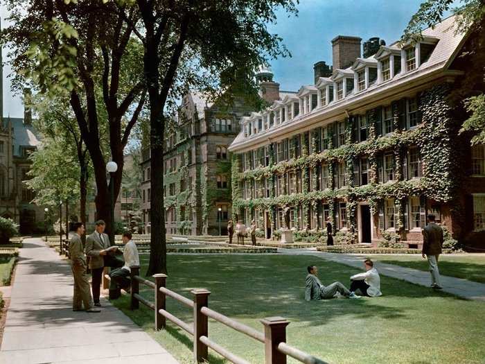 Connecticut, 1936: Connecticut Hall, built in 1752 and wreathed in ivy, provides the backdrop for Yale students relaxing at the university