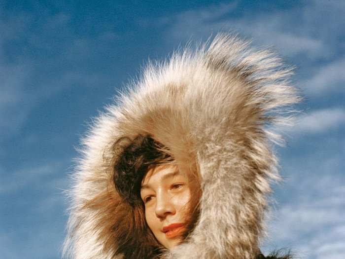 Alaska, 1956: Wreathed in a penumbra of luxurious fur, the winner of the 1955 Miss Arctic Circle contest stands beneath a blue sky at the annual Fourth of July celebration in Kotzebue, Alaska.