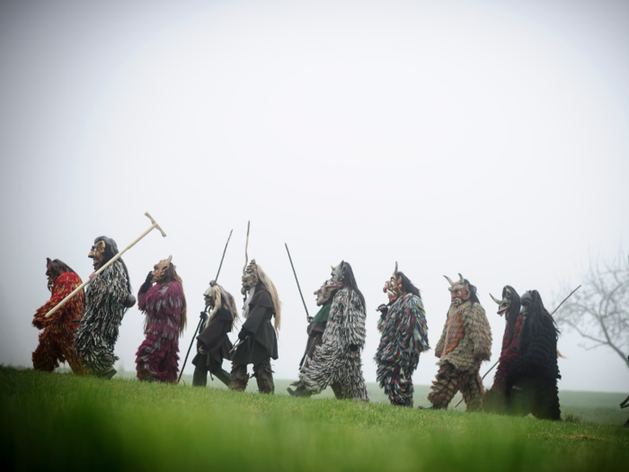 Legend has it that their chains symbolize a binding to the devil by the Christian Church, and the birch branches hail from ancient pagan initiation rites.