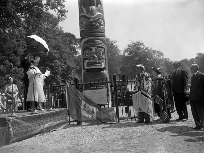 Canada, 1958: Totem pole. Stepping in for Elizabeth, the Queen Mother received a 100-foot Totem pole on her behalf from Chief Mungo Martin of the Kwakiutl Indians, a tribe located on Vancouver Island.