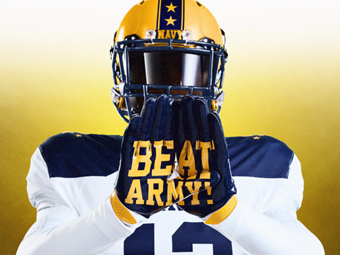 The gloves spell out "Beat Army."