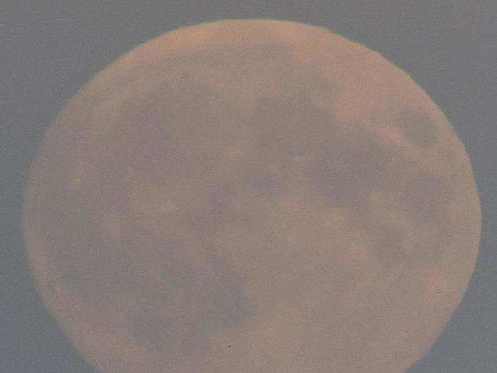 A "supermoon" rises above Brighton in southern England.