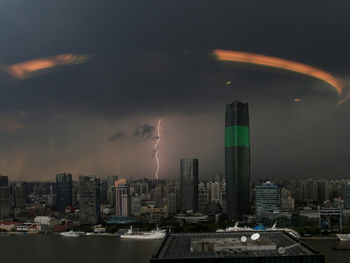 A streak of lightning is seen above the skyline of Shanghai, China.