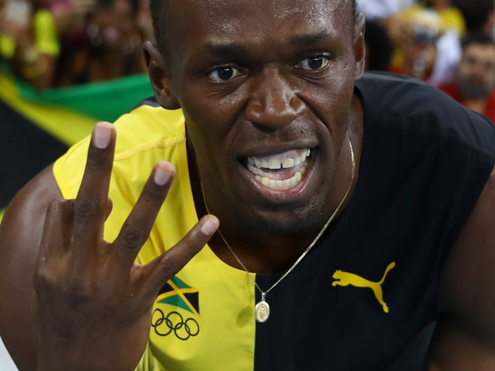 Usain Bolt of Jamaica celebrates winning the Jamaican team