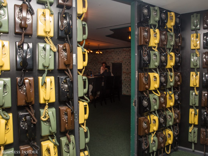 The Empire State Building office also comes equipped with its own secret speakeasy, hidden by a wall of rotary phones.