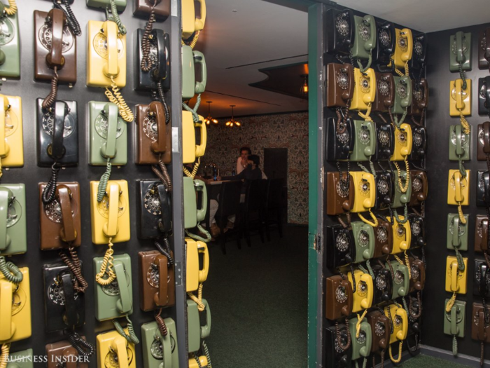 The office even has its own speakeasy, tucked away behind this wall of rotary phones. Employees can congregate here after work, to host happy hours and mingle.