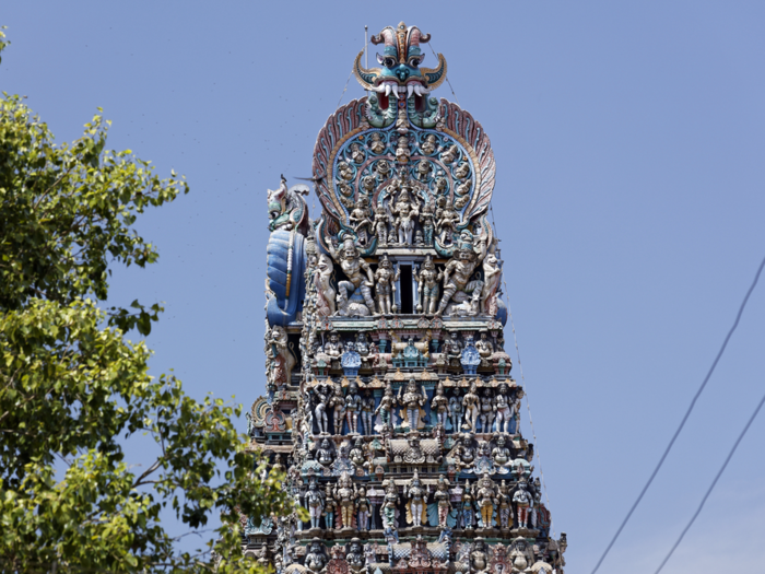 In Madurai, India, sits the busy, multi-colored Meenakshi Amman Temple. From far away, it