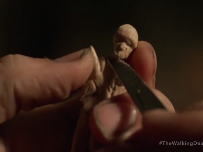 We saw Dwight carving one of his figures back in episode three.