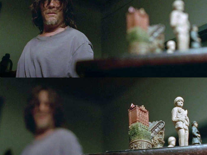 If you paid close attention, Daryl spent a little bit of time glancing at a carved figure on a table before later kicking over a chess table.