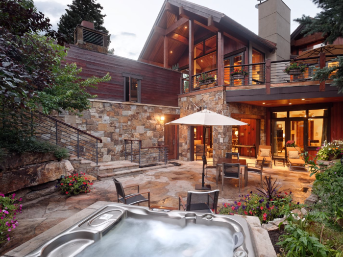 This mountain mansion comes complete with a wine room, Jacuzzi, and antler chandeliers.