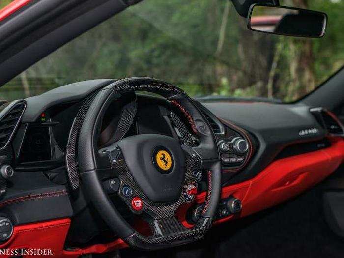 An abundance of carbon fiber and stitched black leather, in both the red and the black.