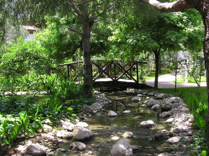 An artificial stream is kept stocked with fish.