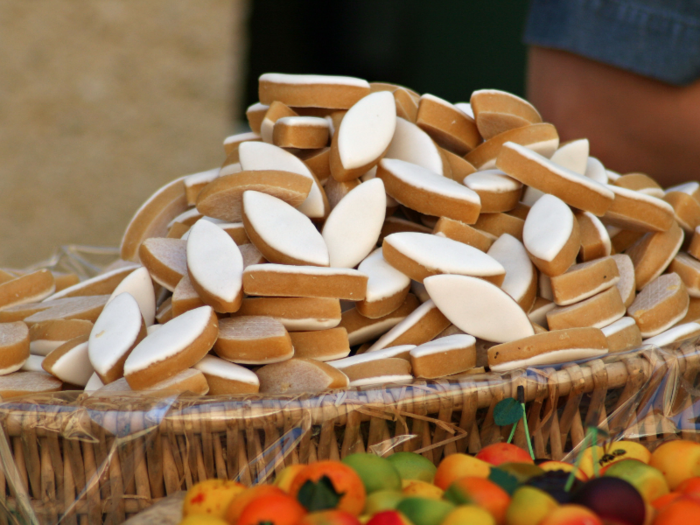 FRANCE: Calissons are a smooth, chewy, almond-flavored candy made with candied fruit and ground almonds, then topped with a thin layer of white icing.