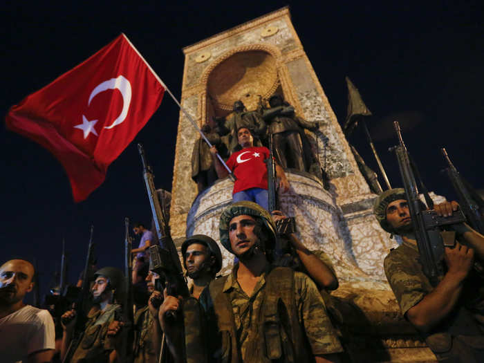 In July, an attempted military coup by a faction within the Turkish armed forces calling itself the "Peace at Home Council" was stifled in less than 24 hours, after Turkish president Recep Tayyip Erdogan called on his supporters to take to the streets and repel the uprising. This photo shows Turkish military standing in front of the Republic Monument at the Taksim Square in Istanbul.