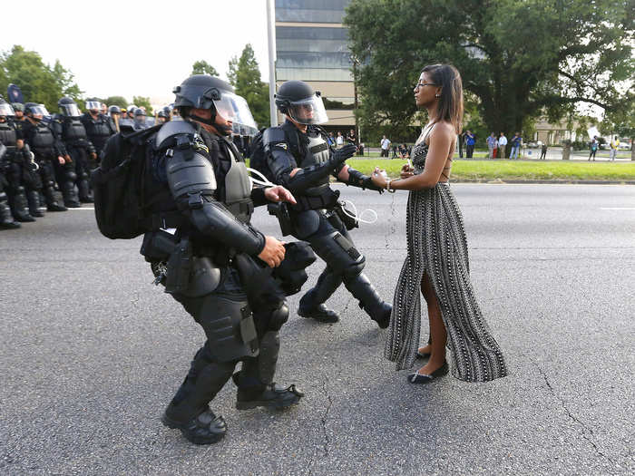 Ieshia Evans was detained by law enforcement in riot gear as she peacefully protested the shooting death of Alton Sterling near the headquarters of the Baton Rouge Police Department in Louisiana. Photographer Jonathan Bachman said: "When I came back to my car and looked through my take I knew I had a strong image... I am grateful that it has stimulated a discussion about an important issue in this country."