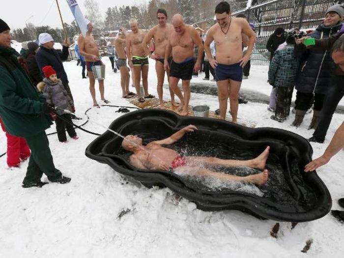 Sashko bathed in cold water to celebrate Polar Bear Day as other members and regular patrons watched.