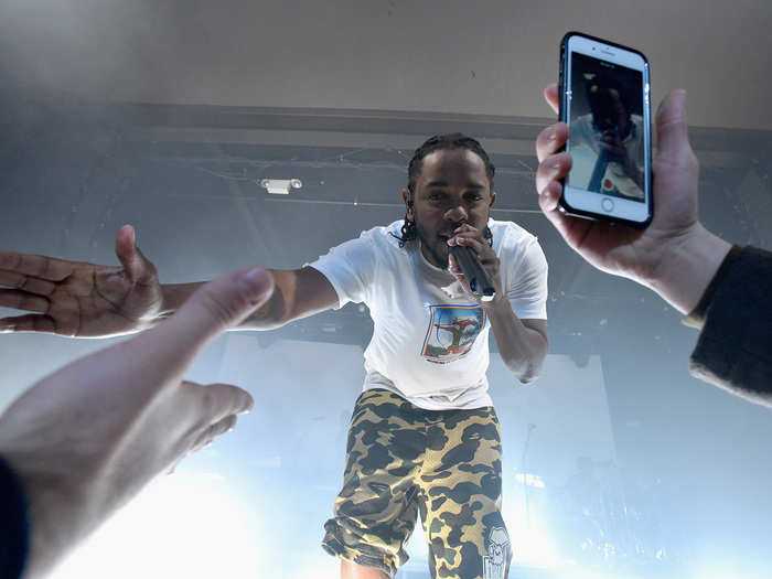 Kendrick is active with the crowd — directly.