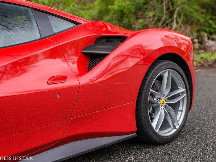 THE REAR END: The biggest new detail is on the rear haunch. The deep cut-in that extends through the door-line has been called an homage to the 308. A nice wedge of carbon fiber bisects a gridded intake scallop.