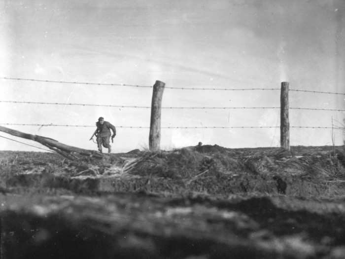 An infantryman from the 82nd Airborne Division goes out on a one-man sortie while covered by a comrade in the background, near Bra, Belgium, on December 24, 1944.