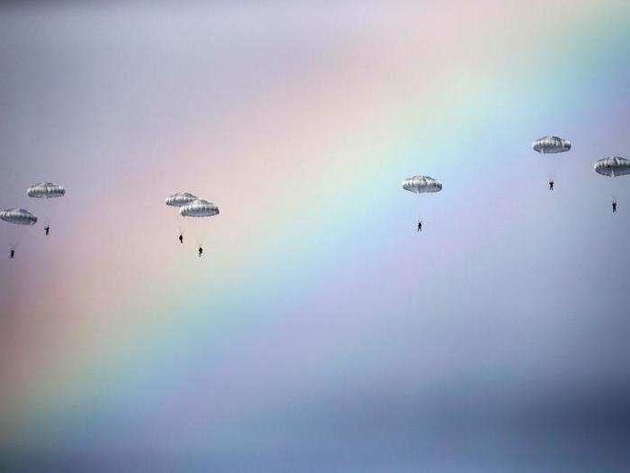 Russian paratroopers jump past a rainbow from an IL-76 transport plane during a joint Serbian-Russian military training exercise, "Slavic Brotherhood," in the town of Kovin, near Belgrade, Serbia on November 7.