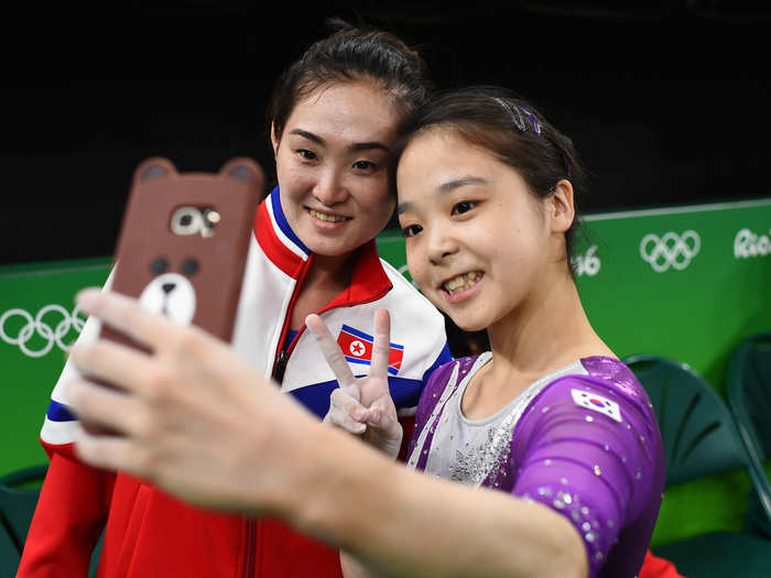 Lee Eun-Ju of South Korea (right) takes a selfie with Hong Un Jong of North Korea (left) during the Olympic Games in Rio de Janeiro, Brazil, on August 4.