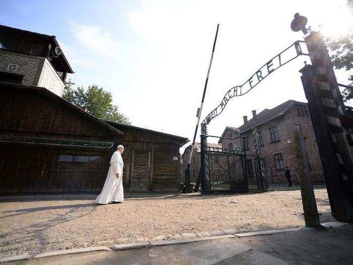 Pope Francis walks through Auschwitz