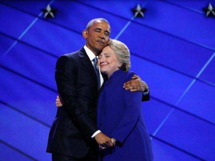 Former Democratic presidential nominee Hillary Clinton hugs President Barack Obama as she arrives onstage at the end of his speech on the third night of the 2016 Democratic National Convention in Philadelphia, Pennsylvania, on July 27.