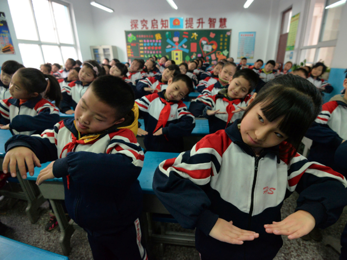 These school children have to exercise indoors, but many of the schools suspended classes.