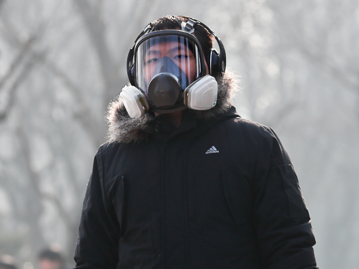 This man dons a full-on respirator, much more heavy duty than the surgical masks more broadly worn throughout Asia.