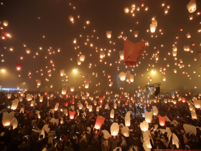 In Croatia, residents release thousands of paper lanterns carrying their Christmas hopes and wishes into the sky at the nation