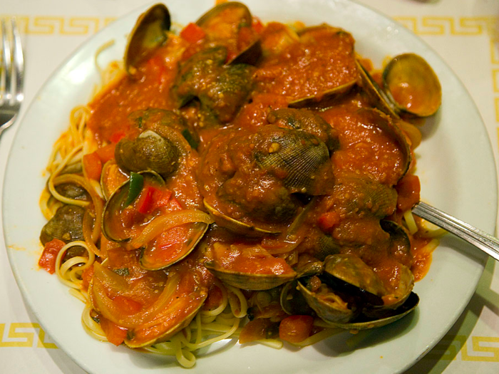 Italians celebrate Christmas by making a meal they call the "Feast of Seven Fishes," which features many different seafood items, like calamari, cod, anchovies, and clam linguine.