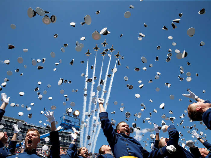 The Thunderbirds performed a fly-over as graduates from the Air Force Academy tossed their hats in the air at the conclusion of their commencement ceremony in Colorado Springs, US.