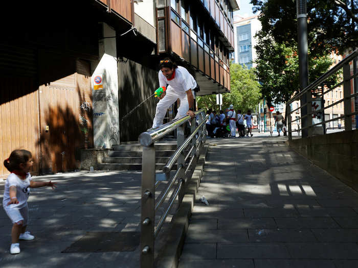 Sergio Colas played with his daughter Alaia during the San Fermin festival in Pamplona, northern Spain.