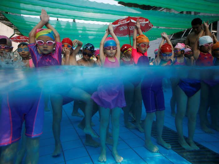 Children attended a swim training session at the Hangzhou Chen Jinglun Sport school Natatorium in Hangzhou, Zhejiang province, China. They were inspired by Chinese Olympic swimmers Sun Yang and Fu Yuanhui, who also trained there.