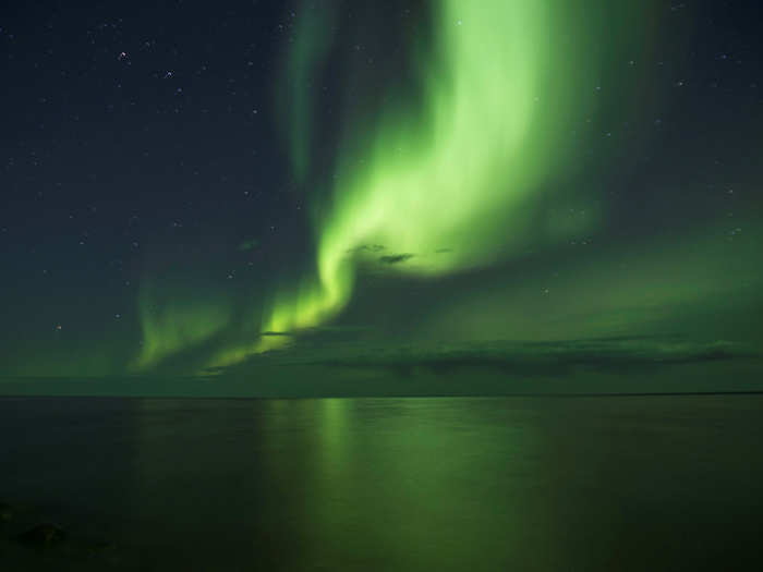 This stunning photo showed the Aurora Borealis — or Northern Lights — appear over Great Bear Lake in Deline, Canada. It is the world