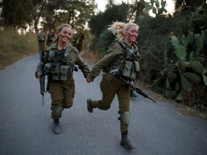 Israeli soldiers of the Search and Rescue brigade held hands as they took part in a training session in Ben Shemen forest, near the city of Modi