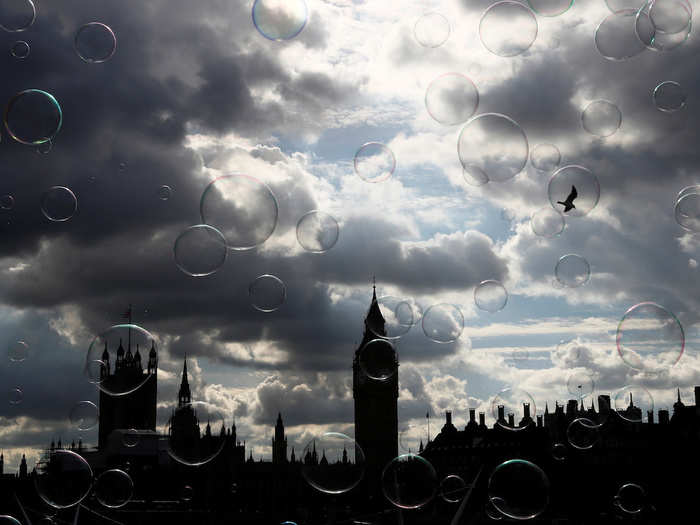 Soap bubbles floated past the Houses of Parliament in central London.