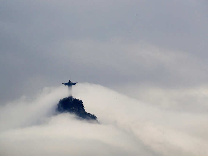 Clouds surrounded the Christ the Redeemer statue over Rio de Janeiro, Brazil.