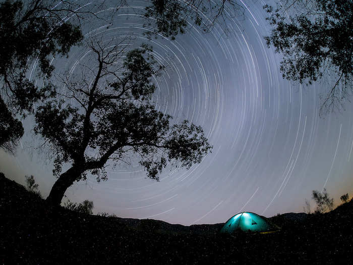 A photographer used a long exposure to capture the star trails in the night sky over a camp in Altyn-Emel national park, Kazakhstan.